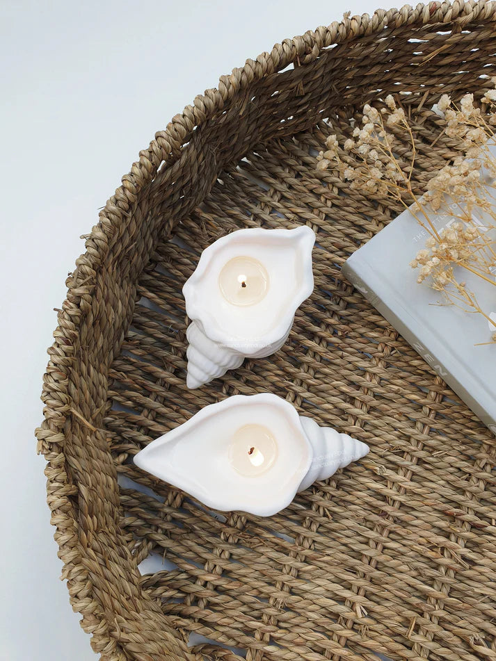 KaressaCandles' Aesthetic Soy Wax Candles in reusable concrete sea shell jars. Pack of 2 with Vanilla and Rose scents, offering 12+ hours burn time. Ideal for home decor in bedrooms and offices.