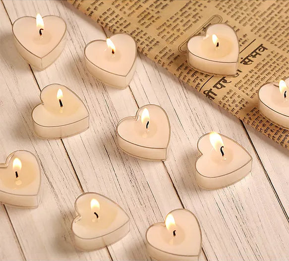 KaressaCandles' Scented Heart Shaped Tea Lights, rose fragrance, pack of 10. Handcrafted soy wax tealights in heart shape, perfect for romantic ambiance and home decor.